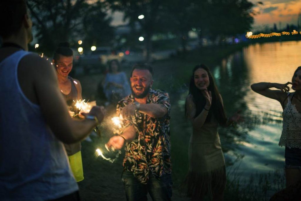 People Enjoying Sparkler in Festival Event