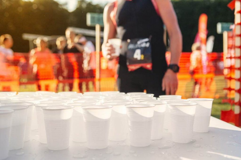 Table with cups of water at sports event